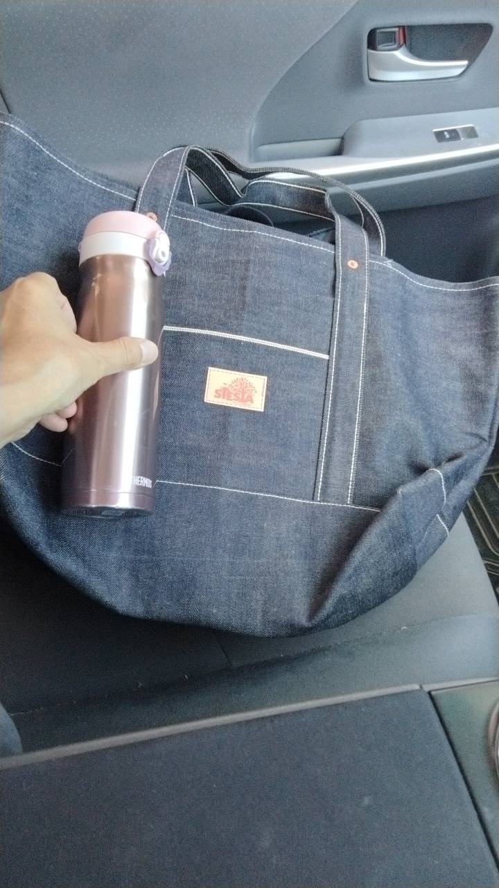 OEM denim tote bag production example with custom pocket and brand label
